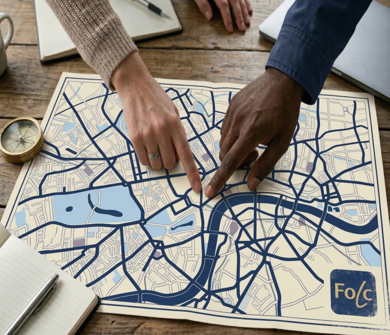 Two hands point at a spot on a map which bears the Folc logo